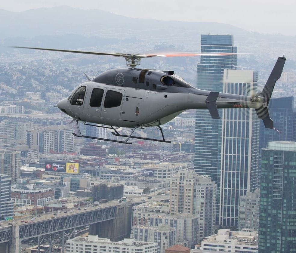 2 men walking away from Bell 525