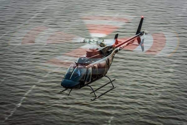 Bell 407 Helicopter Over Water